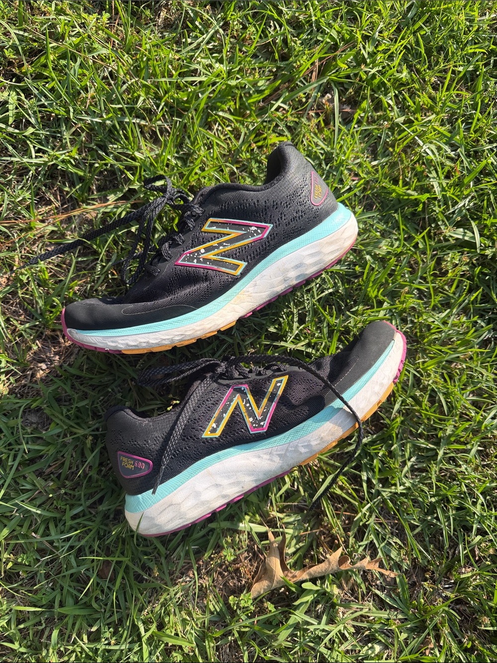 New Balance Women's Black Running Shoes with Teal & Pink Accents